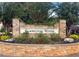 Stone entrance sign for Cambridge Woods, surrounded by vibrant landscaping at 200 Suffolk Way, Mcdonough, GA 30252