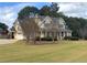 Attractive suburban home with an attached garage and well-maintained landscaping at 200 Suffolk Way, Mcdonough, GA 30252