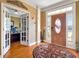 Welcoming foyer with hardwood floors leading to a glass-paneled office at 200 Suffolk Way, Mcdonough, GA 30252