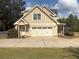 Two-car garage with an adjacent entry door, and lots of driveway space at 200 Suffolk Way, Mcdonough, GA 30252