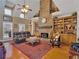 Bright living room boasts a stone fireplace, wood floors, built-in bookshelves and high ceilings at 200 Suffolk Way, Mcdonough, GA 30252