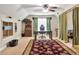 Office with a ceiling fan, desk, storage and unique curtains adding character to the space at 200 Suffolk Way, Mcdonough, GA 30252