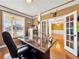 Sunlit office with hardwood floors and glass paneled doors to additional rooms at 200 Suffolk Way, Mcdonough, GA 30252