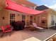 Patio with comfortable seating, a grill, and a shade cover offering a place for relaxation at 200 Suffolk Way, Mcdonough, GA 30252
