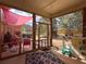Outdoor screened porch featuring comfortable seating, grill area and adjacent play area at 200 Suffolk Way, Mcdonough, GA 30252