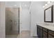 Modern bathroom showcasing a glass-enclosed shower and a sleek vanity with dark wood cabinets at 2872 Evanshire Ave # 116, Duluth, GA 30096