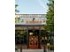 Exterior shot of GS Brewing Co. with a modern facade and bright orange doors at 2872 Evanshire Ave # 116, Duluth, GA 30096