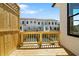 View of an outdoor deck overlooking townhomes at 2872 Evanshire Ave # 116, Duluth, GA 30096