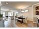Open-concept dining area featuring hardwood floors and neutral decor, perfect for Gathering meals at 2872 Evanshire Ave # 116, Duluth, GA 30096