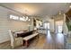 Bright dining area, leading into kitchen, with hardwood floors and modern lighting at 2872 Evanshire Ave # 116, Duluth, GA 30096