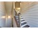 Bright staircase showcasing white shiplap walls with stained wood steps and rail at 2872 Evanshire Ave # 116, Duluth, GA 30096