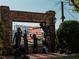 Outdoor art exhibit featuring statues, a mural, and brick pavers at 2872 Evanshire Ave # 116, Duluth, GA 30096