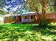 Charming brick home with a well-maintained front yard and a welcoming front porch at 5542 Joeclay Dr, Stone Mountain, GA 30088