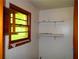 Closet featuring shelves and a window at 5542 Joeclay Dr, Stone Mountain, GA 30088