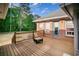 Outdoor deck area with brick accents, overlooking a landscaped backyard at 1030 E Lakehaven Way, Mcdonough, GA 30253