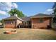 Expansive backyard featuring a brick patio, fire pit, and ample space at 1030 E Lakehaven Way, Mcdonough, GA 30253