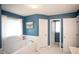 Bathroom features a jetted tub, bright lighting, and a clean, modern aesthetic at 1030 E Lakehaven Way, Mcdonough, GA 30253