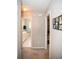 Hallway view leading to a bright bathroom and bedroom areas at 1030 E Lakehaven Way, Mcdonough, GA 30253