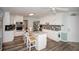 Well-appointed kitchen featuring modern appliances, granite countertops, gray backsplash, and a convenient center island at 1030 E Lakehaven Way, Mcdonough, GA 30253