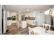 Bright kitchen features an island with granite counters, stainless appliances, and stylish gray backsplash at 1030 E Lakehaven Way, Mcdonough, GA 30253