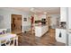 Spacious kitchen with an island, modern appliances, and wood floors perfect for Gathering gatherings at 1030 E Lakehaven Way, Mcdonough, GA 30253