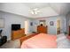 Spacious main bedroom offers abundant natural light, a trey ceiling, and ample space for relaxation at 1030 E Lakehaven Way, Mcdonough, GA 30253