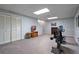 Spacious basement gym area with carpet flooring, shelving and a stationary bike at 4423 Windsor Oaks Cir, Marietta, GA 30066