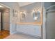 Well-lit bathroom with double vanity, neutral tile, and a glass-enclosed shower at 4423 Windsor Oaks Cir, Marietta, GA 30066