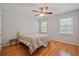Comfortable bedroom with wood floors, ceiling fan, and natural light at 4423 Windsor Oaks Cir, Marietta, GA 30066