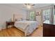 Well-lit bedroom with hardwood floors and a large window at 4423 Windsor Oaks Cir, Marietta, GA 30066