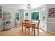 Dining room with bay windows, wood floors, and traditional-style furniture at 4423 Windsor Oaks Cir, Marietta, GA 30066