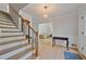Light-filled foyer featuring hardwood floors, staircase, and elegant lighting at 4423 Windsor Oaks Cir, Marietta, GA 30066