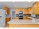 Open kitchen view featuring wood cabinets, stainless steel appliances, and bright countertops at 4423 Windsor Oaks Cir, Marietta, GA 30066