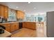 Open kitchen with wood cabinets, a breakfast nook, and hardwood flooring at 4423 Windsor Oaks Cir, Marietta, GA 30066