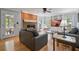 Cozy living room with a brick fireplace, built-in shelving, and access to the sunroom at 4423 Windsor Oaks Cir, Marietta, GA 30066