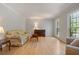Bright living room with hardwood floors, large windows, and comfortable seating at 4423 Windsor Oaks Cir, Marietta, GA 30066