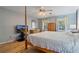 Spacious main bedroom featuring hardwood floors, a ceiling fan, and natural light from two windows at 4423 Windsor Oaks Cir, Marietta, GA 30066