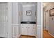 Charming wet bar area with custom cabinetry, dark countertop, and decorative wall panels at 4423 Windsor Oaks Cir, Marietta, GA 30066