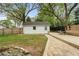 View of the backyard with lawn, shed and a long wooden bench at 502 Allgood Ne Rd, Marietta, GA 30060