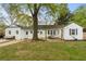 Large backyard featuring a pergola, hammock, patio, and lush green lawn at 502 Allgood Ne Rd, Marietta, GA 30060