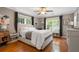 Comfortable bedroom with hardwood floors, large windows, and great natural light at 502 Allgood Ne Rd, Marietta, GA 30060