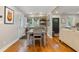 Dining area featuring hardwood floors, natural light, and access to the backyard at 502 Allgood Ne Rd, Marietta, GA 30060