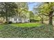 Quaint home with black shutters and lush landscaping providing privacy at 502 Allgood Ne Rd, Marietta, GA 30060