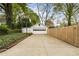 Detached garage with an extended driveway, basketball hoop, and surrounding greenery at 502 Allgood Ne Rd, Marietta, GA 30060