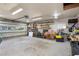 Garage interior with an open garage door, concrete floors and storage shelves at 502 Allgood Ne Rd, Marietta, GA 30060