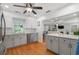 Open kitchen view with light countertops, stainless steel appliances, and view of the living room at 502 Allgood Ne Rd, Marietta, GA 30060