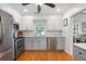 Bright kitchen features stainless appliances, light countertops, and hardwood floors at 502 Allgood Ne Rd, Marietta, GA 30060