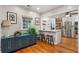 Open kitchen with modern white cabinetry, stainless steel appliances, and barstool seating at 502 Allgood Ne Rd, Marietta, GA 30060