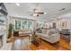 Bright living room featuring hardwood floors, a fireplace, and an open floor plan at 502 Allgood Ne Rd, Marietta, GA 30060