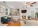 Cozy living room features a fireplace, stylish furnishings, and an abundance of natural light at 502 Allgood Ne Rd, Marietta, GA 30060
